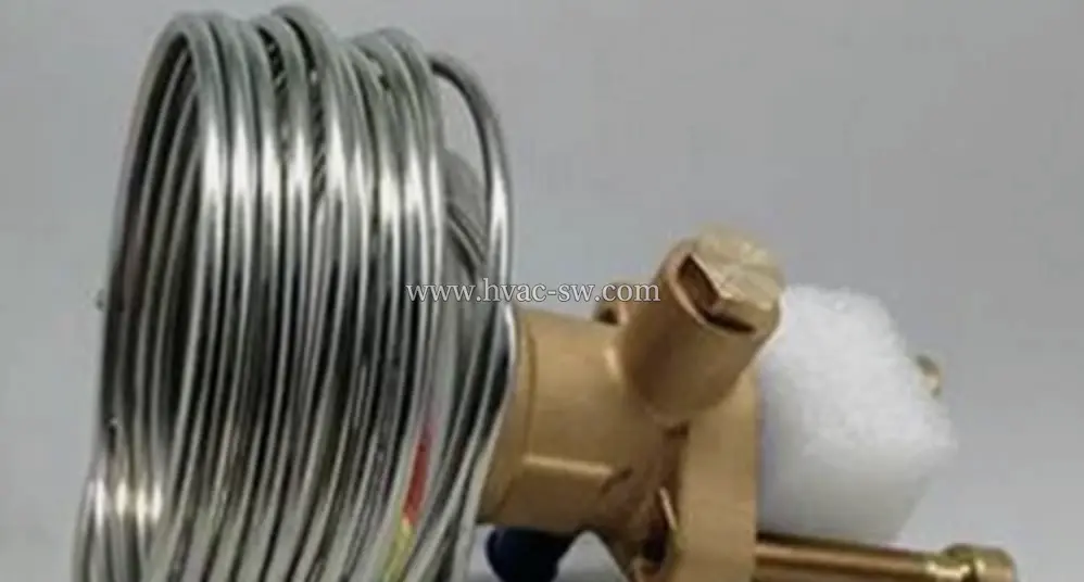 Emerson thermal expansion valve assembly showing brass valve body and coiled sensing element for refrigeration systems